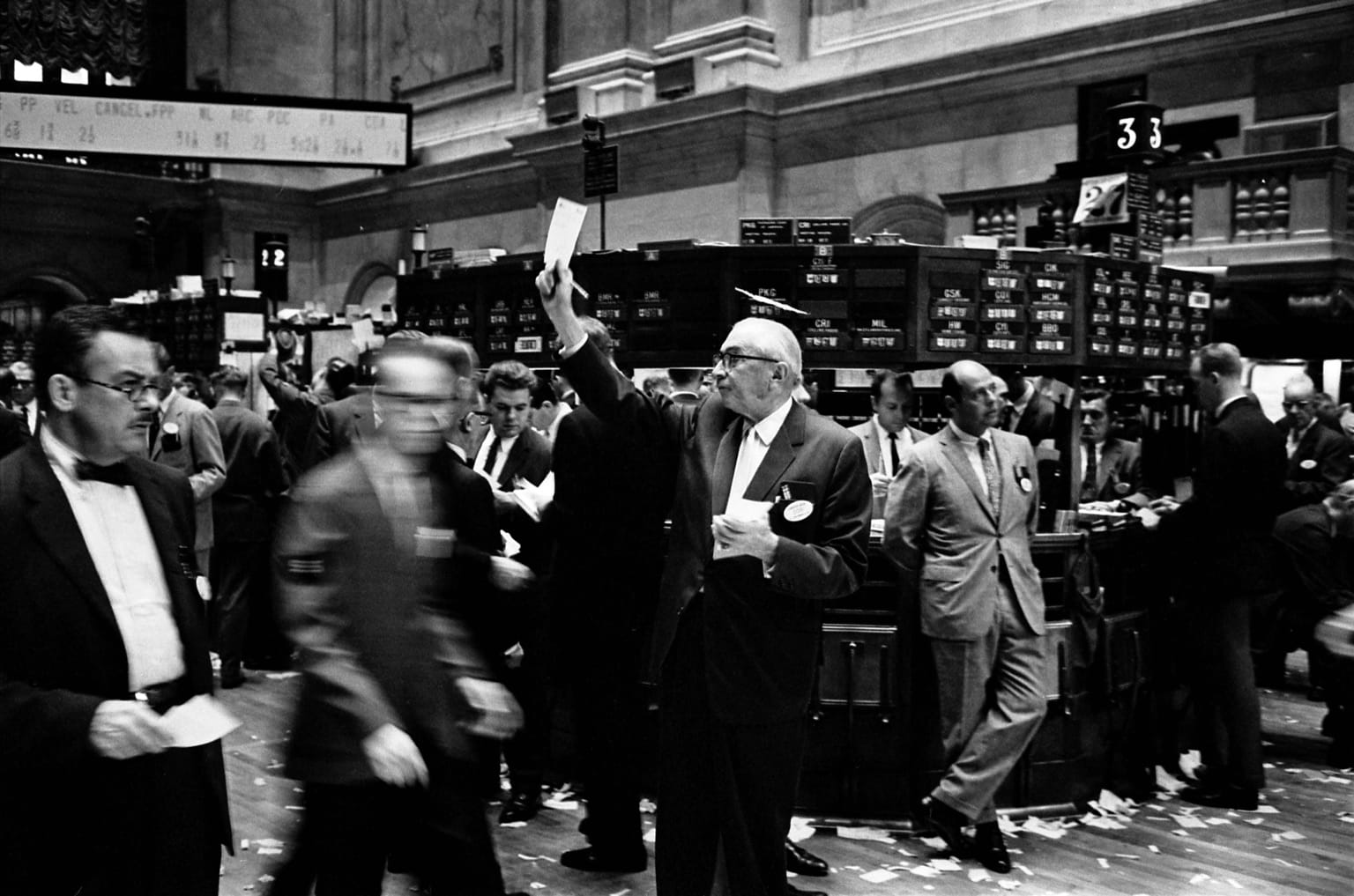 Traders on the floor of the New York Stock Exchange in a Library of Congress photograph by Thomas J. O'Halloran, used as the ThriveInMarkets hero for an October 1 2026 review of Ray Dalio's Diary of a CEO comments on an AI bubble and borrowing against stocks