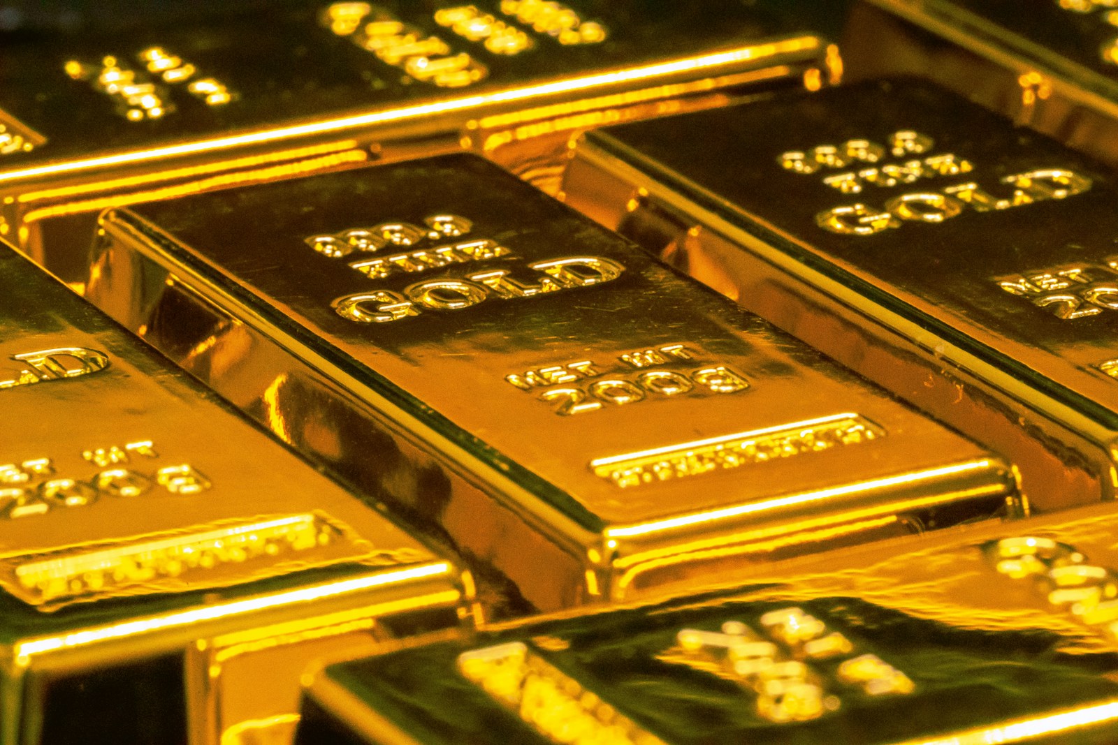 Gold bars and financial charts representing market surge