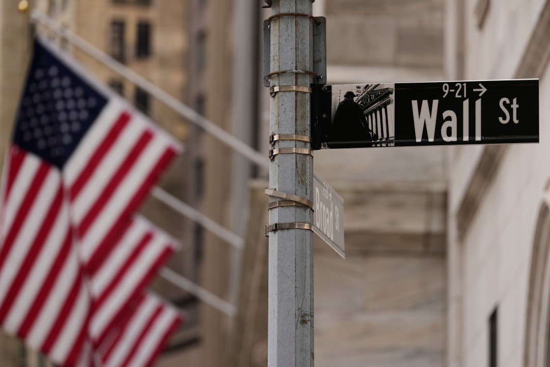 A Wall Street street sign above Broad Street with American flags in the background, used as the ThriveInMarkets evening-review hero for Wednesday September 2 2026, when the S&P 500 closed 7,667, up 0.46 percent, snapping a three-day losing streak as Dell jumped 15.8 percent on a 95 billion dollar AI server backlog and West Texas Intermediate settled 90.76 dollars after tagging 92.29
