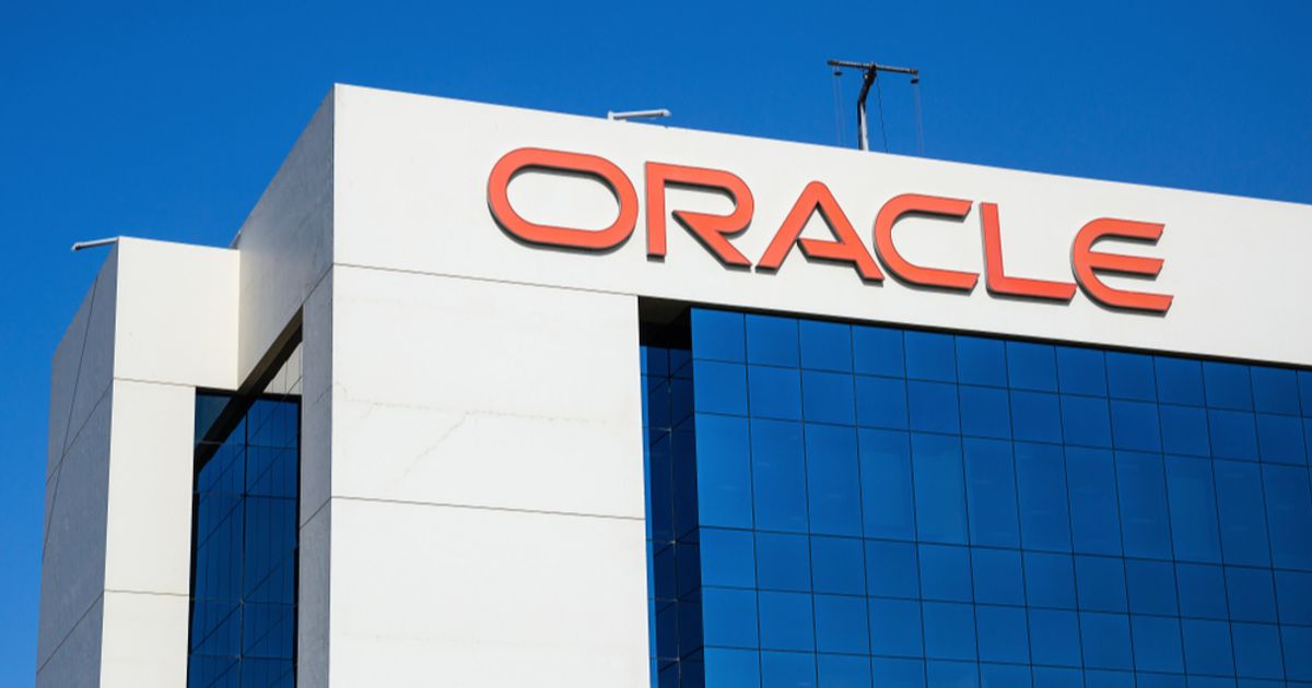 The Oracle logo on a white office building against a clear blue sky, used as the ThriveInMarkets evening-review inline image for Thursday September 10 2026, when Oracle reported 19.3 billion dollars of first-quarter revenue and 1.92 dollars of adjusted EPS, both ahead of estimates, cloud infrastructure revenue more than doubled to 7.4 billion, remaining performance obligations rose to 664 billion, and shares jumped about 6 percent after hours