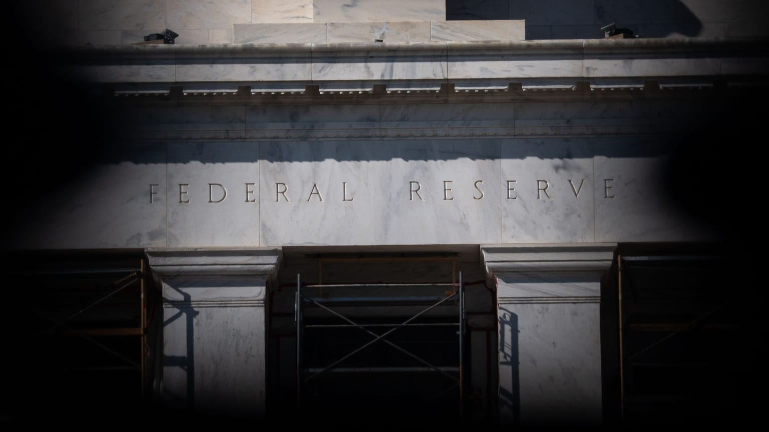 The marble facade of the Federal Reserve building in Washington, D.C., with FEDERAL RESERVE carved above scaffolding, used as the ThriveInMarkets evening-review hero for Wednesday September 16 2026, when Chair Kevin Warsh's first FOMC hiked 25 basis points to 3.75 to 4.00 percent, 12 of 18 officials penciled in one more 2026 hike, and the S&P 500 closed 7,551.81
