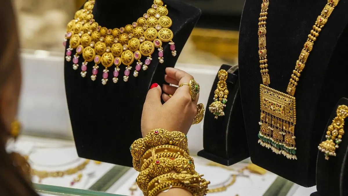 Gold necklaces, bangles and earrings on black display busts in a jewelry shop, used as the ThriveInMarkets evening-review inline image for Friday October 9 2026, when spot gold last printed about 4,196 dollars after tagging a one-week high near 4,208