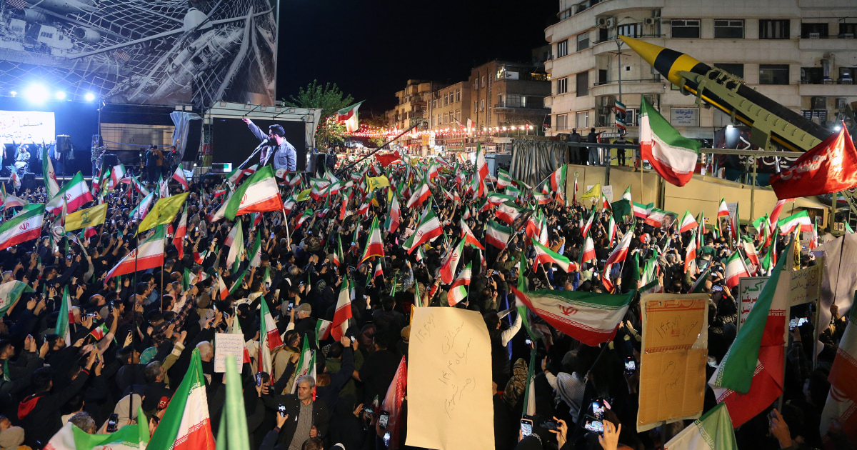 Tehran cityscape and Strait of Hormuz shipping tensions on Thursday April 23 2026 as Iran seizes commercial vessels after Trump extends ceasefire indefinitely and US blockade turns back 31 tankers