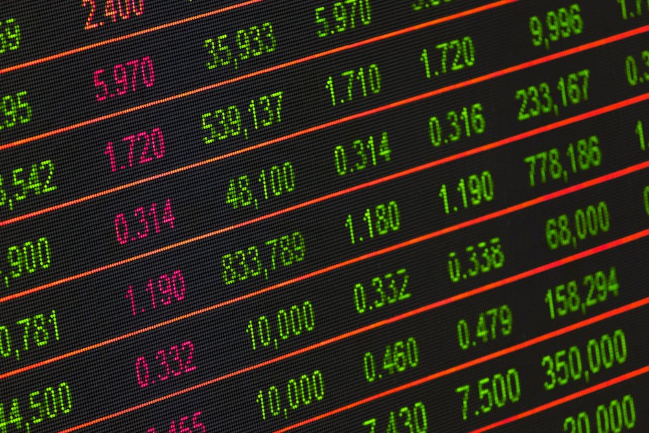 Wall Street trading floor monitors and tickers showing Palantir, AMD and S&P futures into a stacked earnings and NFP week, ThriveInMarkets daily analysis May 4 2026