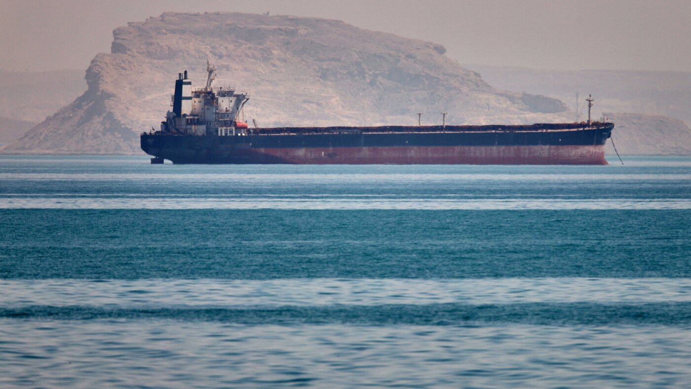 Bulk cargo ship at anchor in the Strait of Hormuz off Bandar Abbas Iran representing the Project Freedom pause and the WTI -3.9% relief move to $102.27, ThriveInMarkets daily analysis May 6 2026