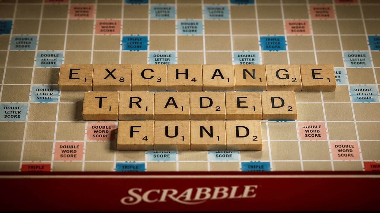 Wooden Scrabble tiles spell out the words exchange traded fund on a game board, illustrating the June 23 2026 ThriveInMarkets morning analysis section on crypto fund flows as spot Ethereum ETFs logged a fourth straight day of outflows near 4.95 million dollars while spot Bitcoin ETFs recovered with BlackRock's IBIT leading an 86 million dollar inflow that broke a streak after 1.67 billion dollars left the category the prior week, with Bitcoin holding near 63,900 dollars and Ethereum outpacing it up about 2.7 percent toward 1,690 dollars