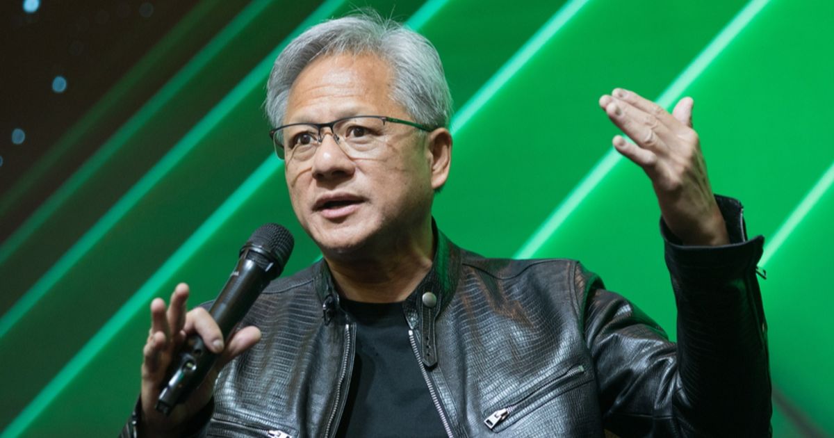 Nvidia CEO Jensen Huang speaking into a microphone in a black leather jacket against a green lit stage, used as the ThriveInMarkets morning analysis hero for Thursday August 27 2026, when Nvidia shares jumped about 4.7 percent after hours on a 108 billion dollar third-quarter revenue guide and a first-time fiscal 2028 growth outlook of about 70 percent, lifting overnight E-mini S&P 500 futures toward 7,715 after Wednesday's 7,675.70 cash close