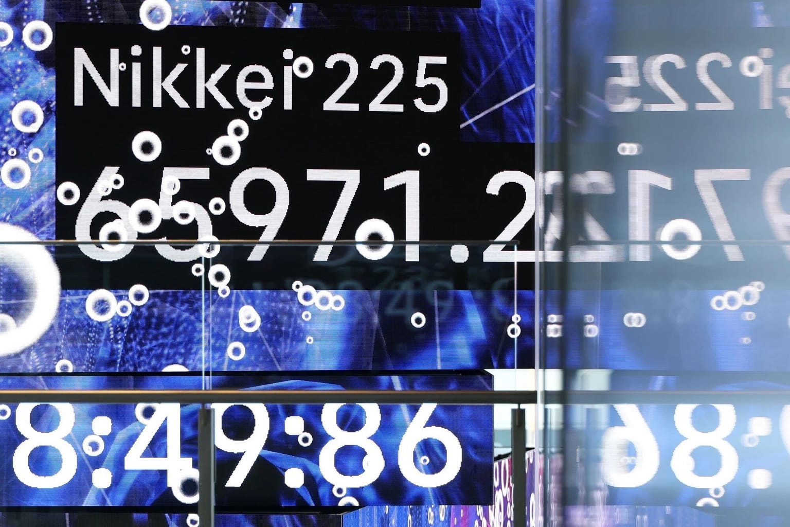 A Tokyo electronic board showing the Nikkei 225 around 65,971, used as the ThriveInMarkets morning analysis inline image for Friday August 28 2026, when Asian shares turned cautious after Thursday's Nvidia-led US rally, Japan's Nikkei rose about 0.5 percent, South Korea's KOSPI fell about 1 percent, and overnight E-mini S&P 500 futures held near 7,744 into Chair Kevin Warsh's first Jackson Hole keynote