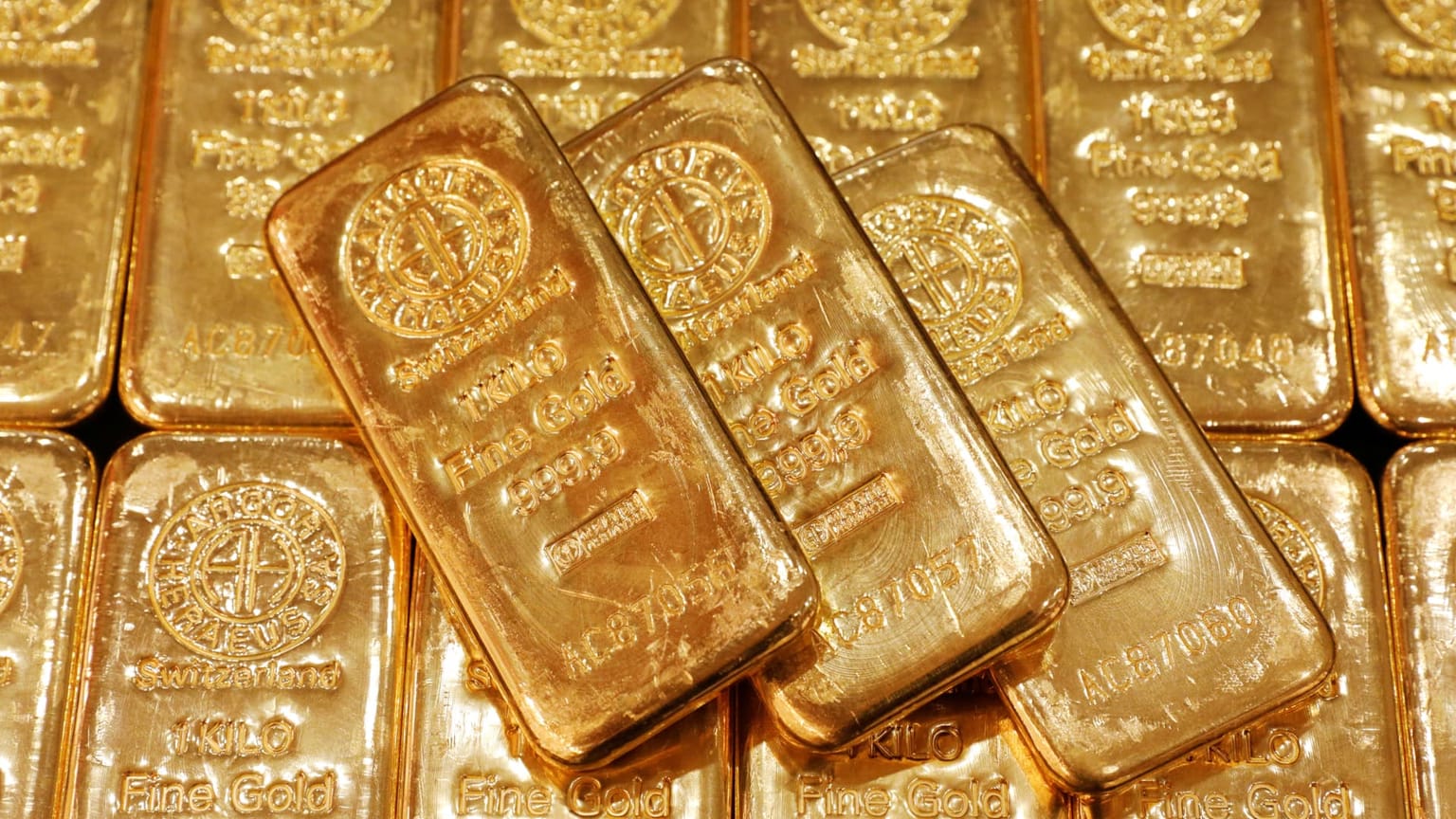 Argor-Heraeus one-kilo fine gold bars stacked on a tray, used as the ThriveInMarkets morning analysis inline image for Tuesday September 15 2026, when spot gold held about 4,288 dollars into a roughly 92 percent chance of a Wednesday FOMC hike, West Texas Intermediate reclaimed about 103 dollars, and overnight E-mini S&P 500 futures sat near 7,598