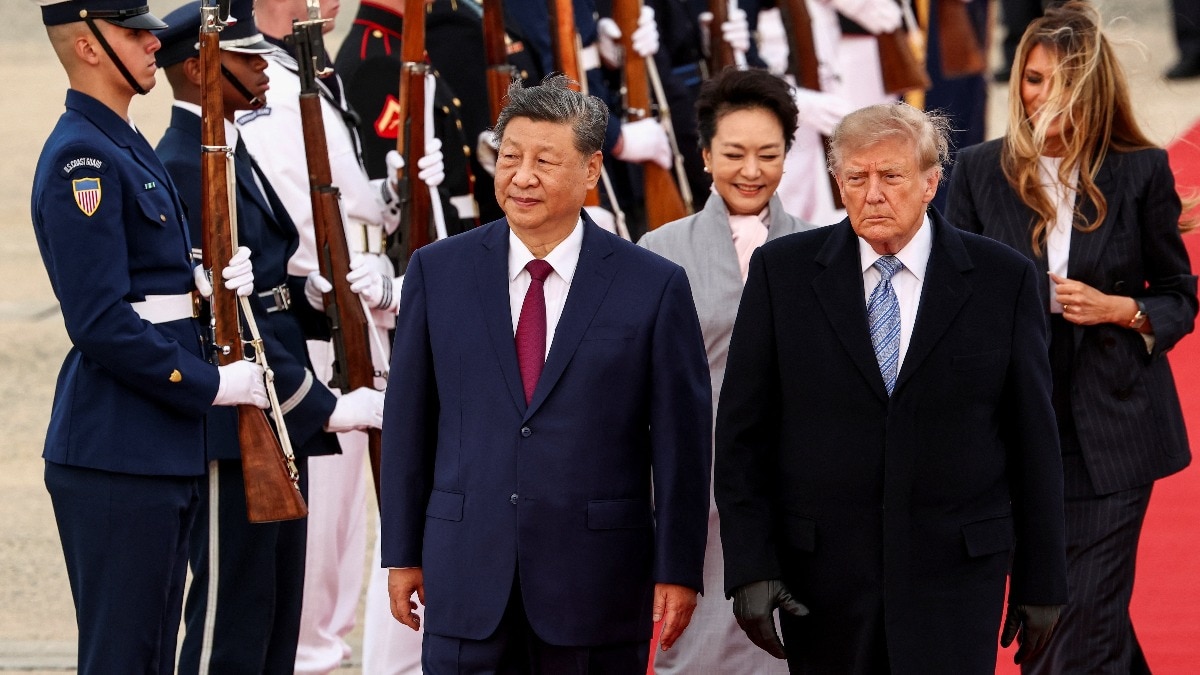 US President Donald Trump and Chinese President Xi Jinping walk a red carpet at Joint Base Andrews in Maryland on 23 September 2026 with Peng Liyuan and Melania Trump and an honor guard, used as the ThriveInMarkets morning analysis hero for Thursday September 24 2026, when Trump hosts Xi at the White House after a two-month extension of the Busan trade truce to January 10, overnight E-mini S&P 500 December futures sat near 7,746 against Wednesday's 7,706.03 cash close, and West Texas Intermediate November futures last printed about 91.50 dollars