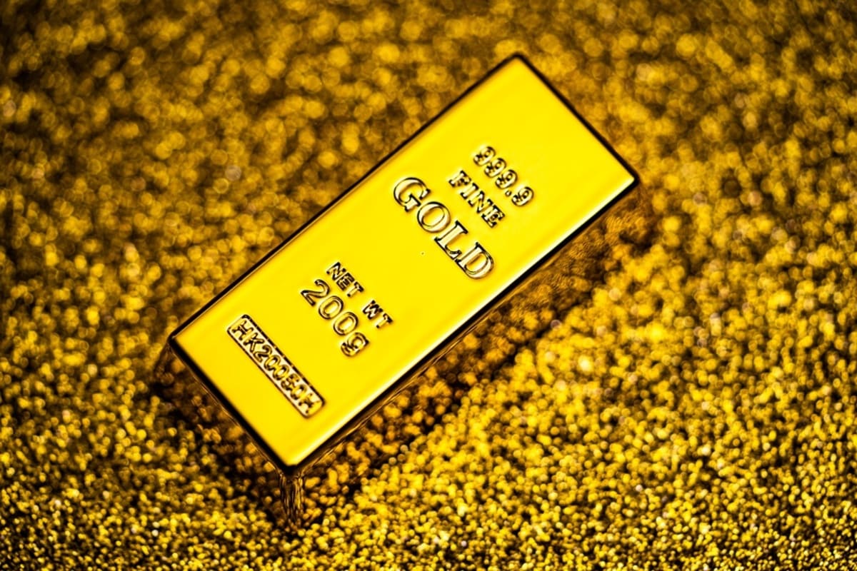 A 200-gram 999.9 fine gold bar on a glittered gold surface, used as the ThriveInMarkets morning analysis hero for Friday October 9 2026, when spot gold last printed about 4,192 dollars, up 1.4 percent, rebounding toward 4,200 after Wednesday's two-month low as Treasury yields eased and the dollar pulled back
