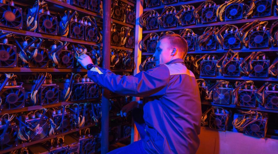Bitcoin mining rigs in a data center representing the industry's pivot to AI and HPC infrastructure