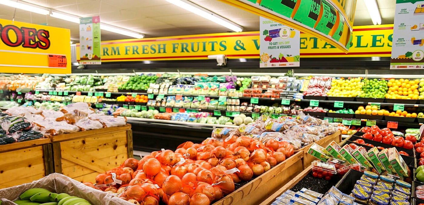 A grocery store fruit section, used as the ThriveInMarkets mid-day pulse inline image for Monday October 5 2026, when the ISM services prices index hit 74, the highest since July 2022, while the S&P 500 held a gain near 7,758