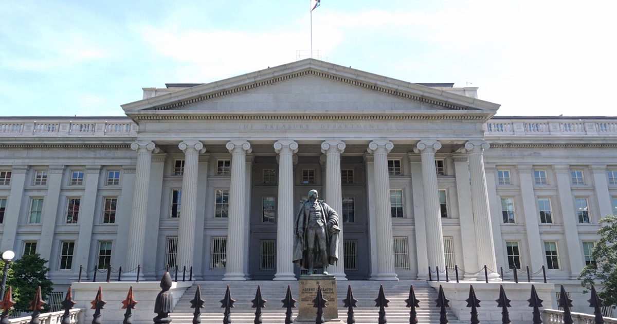 The north front of the United States Treasury Department in Washington, with the Albert Gallatin statue and the words THE TREASURY DEPARTMENT carved on the pediment, used as the ThriveInMarkets hero for the September 26 2026 article on whether a US debt reset has started