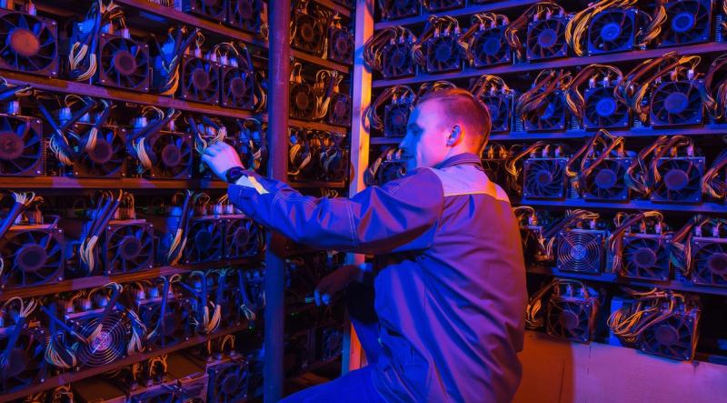 Bitcoin mining rigs as miners face $19,000 loss per BTC produced March 2026