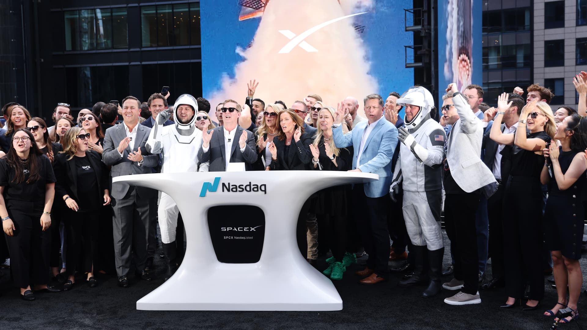 SpaceX executives and employees ring the Nasdaq opening bell on June 12 2026 to mark the company's record-breaking IPO under the ticker SPCX, the week the largest initial public offering in history raised about 75 billion dollars at a 1.77 trillion dollar valuation and closed up 19 percent at 160.95 dollars, while the S&P 500 ground back to fresh record highs near 7,431, WTI crude drained its war premium from about 92 dollars toward 83 dollars on hopes of a US-Iran peace deal that would reopen the Strait of Hormuz, hot May inflation at 4.2 percent killed Federal Reserve rate-cut bets, Intel surged on a reported Google order for more than 3 million AI chips, and bitcoin held near 63,000 dollars while XRP and Solana led a tentative altcoin bounce