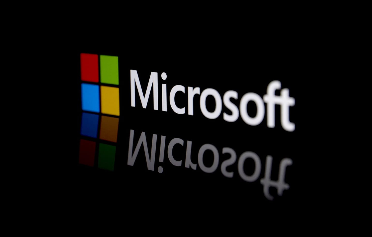 The Microsoft logo on a dark reflective surface, used as the ThriveInMarkets weekly markets roundup hero for September 20 to 26 2026, when President Trump and President Xi extended the Busan trade truce to January 10, Akamai signed an 11.6 billion dollar Anthropic compute pact, Microsoft closed Friday at 516.17 dollars after a Copilot overhaul, and US spot crypto ETFs took about 3 billion dollars
