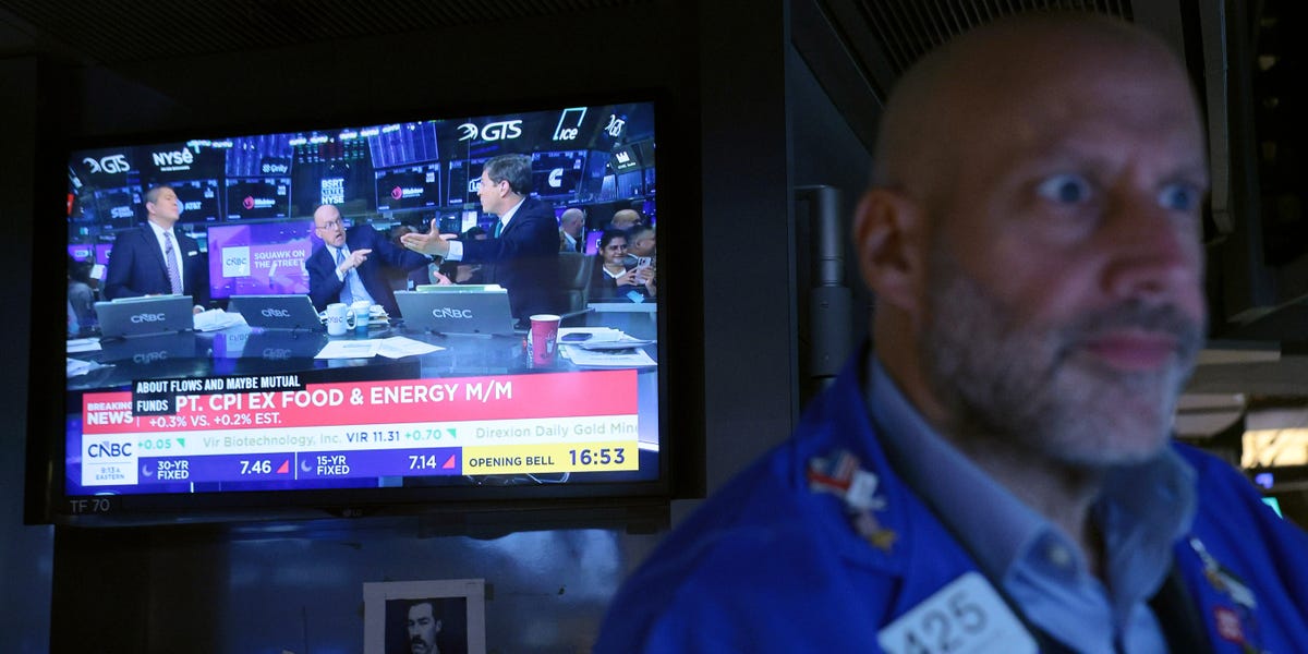 A New York Stock Exchange floor trader in a blue jacket watches a CNBC screen showing Squawk on the Street and a CPI print, used as the ThriveInMarkets weekly markets roundup hero for October 11 to October 17 2026, when the Nasdaq Composite closed Friday at 26,140.03 down 4.5 percent on the week, its worst week since June, after South Korea's Kospi triggered circuit breakers and September CPI printed 3.7 percent